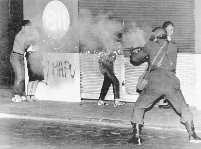 Framed Print : Riot Policeman Firing at Protesters Framed Print : Riot Policeman Firing at Protesters