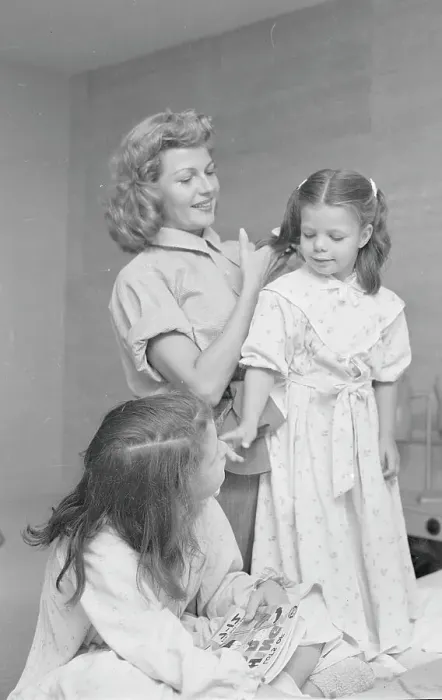 Framed Print : Rita Hayworth Combing Daughter's Hair Framed Print : Rita Hayworth Combing Daughter's Hair