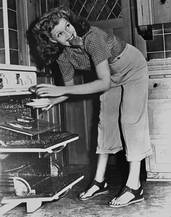 Framed Print : Rita Hayworth Eating a Snack Framed Print : Rita Hayworth Eating a Snack