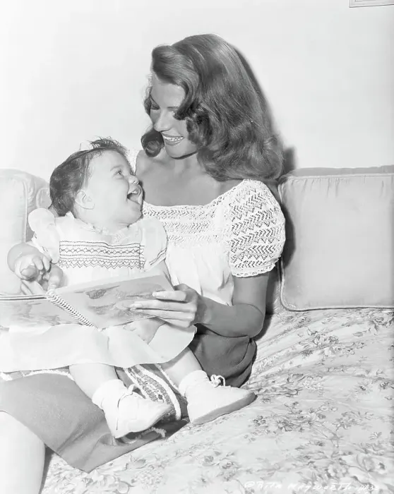 Framed Print : Rita Hayworth Reading to Daughter Framed Print : Rita Hayworth Reading to Daughter