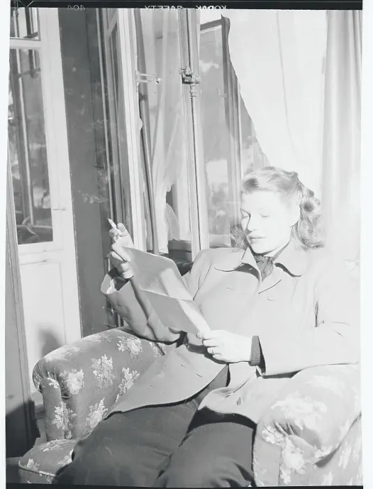 Framed Print : Rita Hayworth Reading Papers