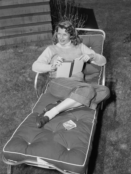 Framed Print : Rita Hayworth Relaxing on Lounge Chair with Book Framed Print : Rita Hayworth Relaxing on Lounge Chair with Book