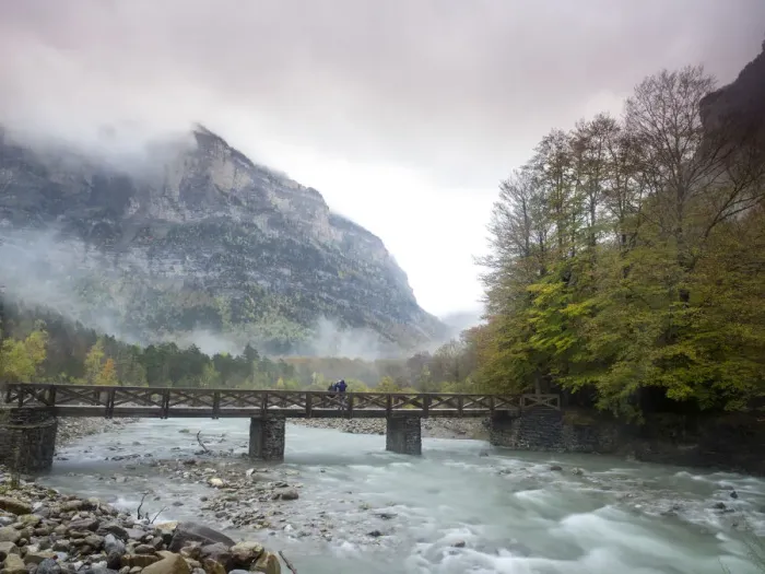 Framed Print : River of mountain with a bridge of wood a rainy day in autumn Framed Print : River of mountain with a bridge of wood a rainy day in autumn