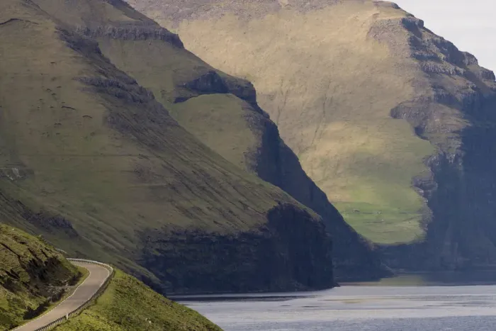 Framed Print : Road and mountains towering from the sea, Kalsoy, Norooyar, Faroe Islands, Denmark Framed Print : Road and mountains towering from the sea, Kalsoy, Norooyar, Faroe Islands, Denmark