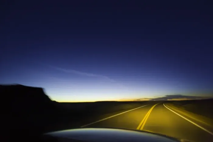 Framed Print : Road past sandstone buttes, lit by headlights, night (blurred motion)