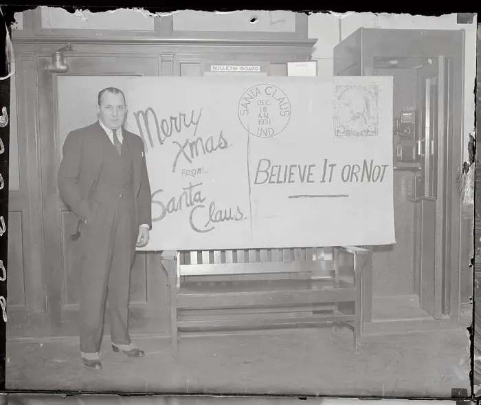 Framed Print : Robert L. Ripley Posing by Large Card Framed Print : Robert L. Ripley Posing by Large Card