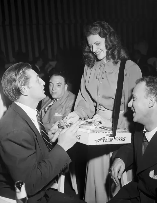Framed Print : Robert Mitchum Buys from Cigarette Girl Framed Print : Robert Mitchum Buys from Cigarette Girl