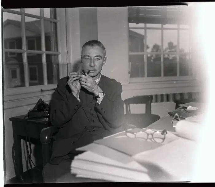 Framed Print : Robert Oppenheimer Lighting a Pipe Framed Print : Robert Oppenheimer Lighting a Pipe