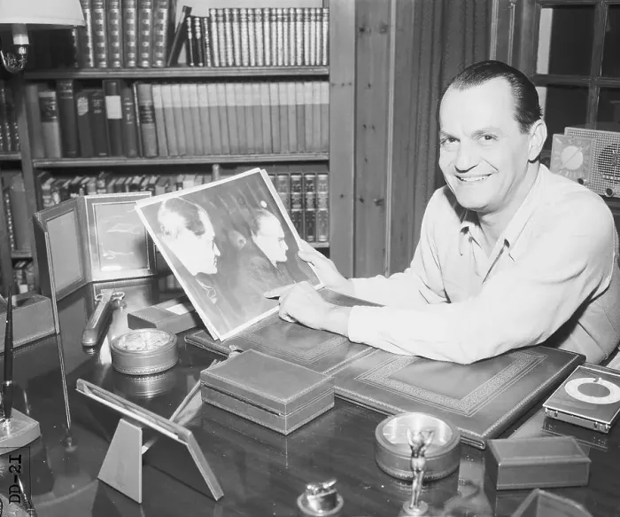 Framed Print : Robert Vogeler at his Desk Holding Photograph Framed Print : Robert Vogeler at his Desk Holding Photograph