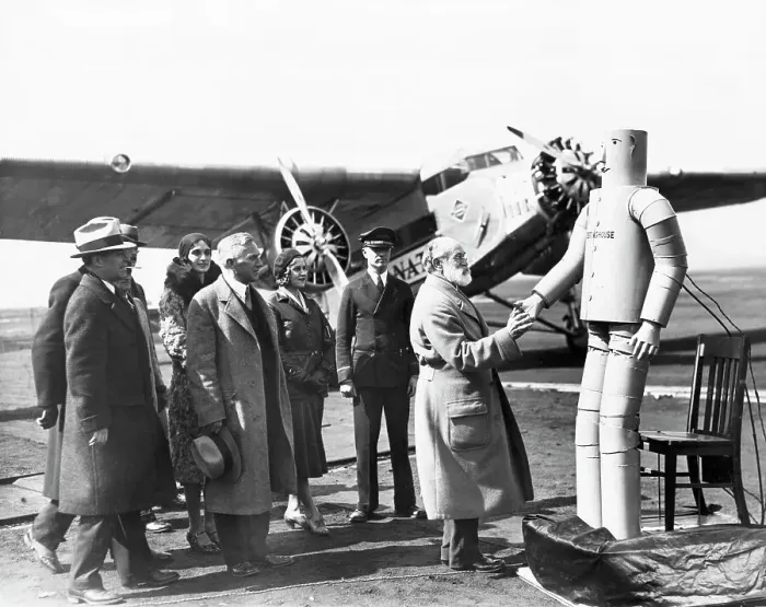 Framed Print : Robot Shakes Elderly Pilot'S Hand Framed Print : Robot Shakes Elderly Pilot'S Hand