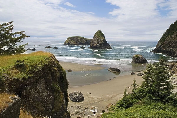 Rock Formations In The Water And Beach Along The Oregon Coast