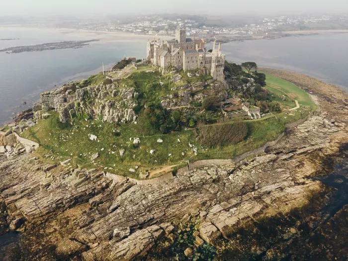 Framed Print : Rocky footpath connects St Michael Mountain with mainland in Mount's Bay, Cornwall, England. June 02, 2021