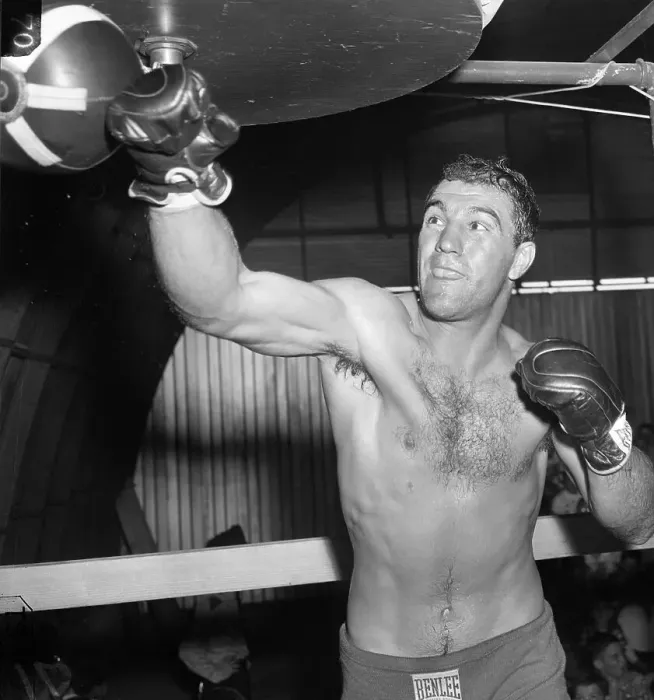 Framed Print : Rocky Marciano Hitting Punching Bag