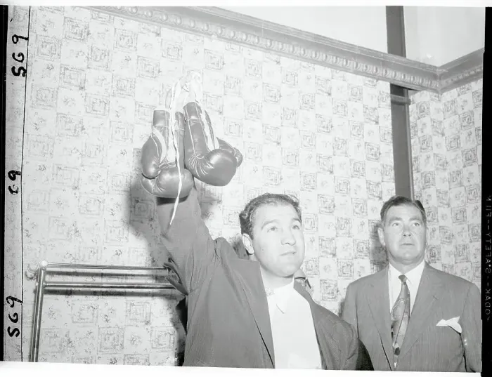 Framed Print : Rocky Marciano Holding Up His Boxing Gloves Framed Print : Rocky Marciano Holding Up His Boxing Gloves
