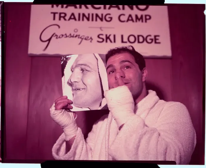 Framed Print : Rocky Marciano Holding Photo Framed Print : Rocky Marciano Holding Photo