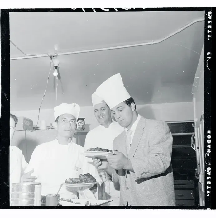 Framed Print : Rocky Marciano Inspecting a Steak Framed Print : Rocky Marciano Inspecting a Steak