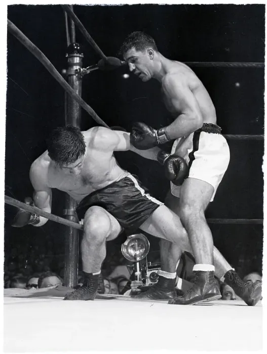 Framed Print : Rocky Marciano Punching Boxer in Corner Framed Print : Rocky Marciano Punching Boxer in Corner
