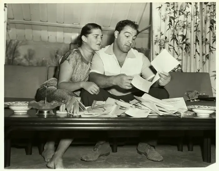 Framed Print : Rocky Marciano Reading Fan Mail with Wife Framed Print : Rocky Marciano Reading Fan Mail with Wife