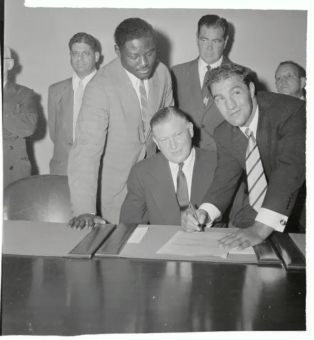 Framed Print : Rocky Marciano Signing Form Framed Print : Rocky Marciano Signing Form