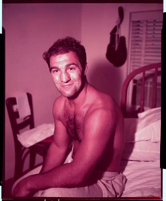 Framed Print : Rocky Marciano Sitting on Bed Framed Print : Rocky Marciano Sitting on Bed