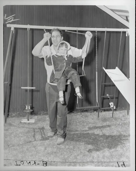 Framed Print : Rocky Marciano Swinging Daughter Outside Framed Print : Rocky Marciano Swinging Daughter Outside