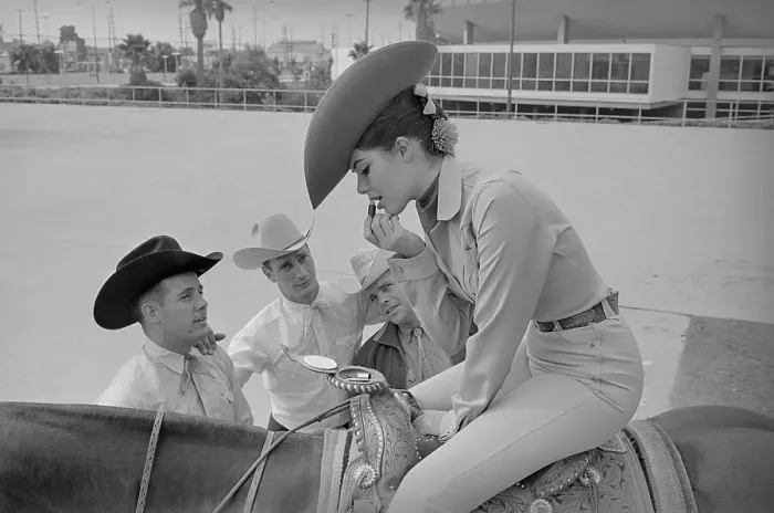 Framed Print : Rodeo Queen Applying Makeup with Mirror in Saddle Horn Framed Print : Rodeo Queen Applying Makeup with Mirror in Saddle Horn