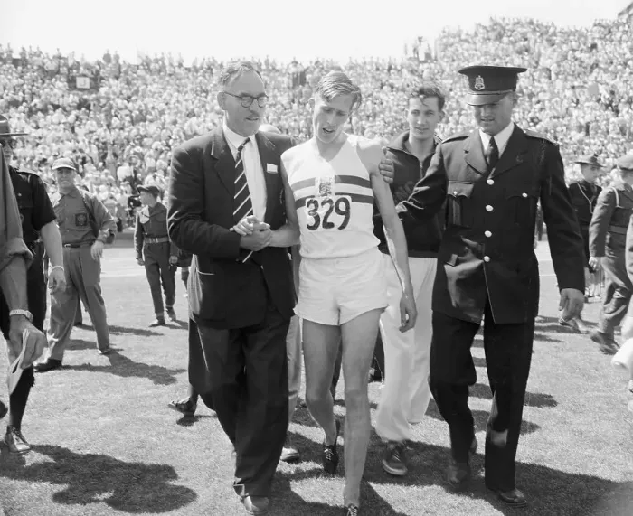 Framed Print : Roger Bannister Being Helped Off Racetrack Framed Print : Roger Bannister Being Helped Off Racetrack