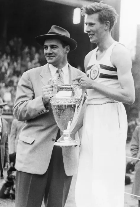 Framed Print : Roger Bannister Holding the Winner's Cup