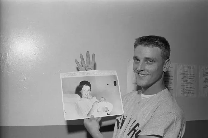 Framed Print : Roger Maris Holding Photo of Child Framed Print : Roger Maris Holding Photo of Child