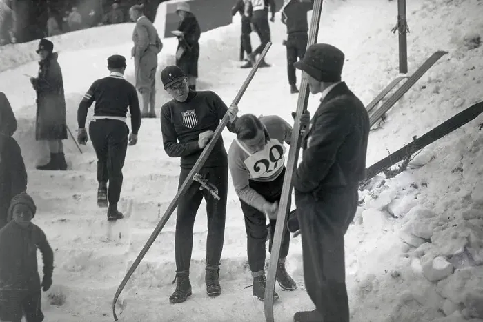 Framed Print : Rolf Munsen Adjusting Skis at Winter Games in Moritz