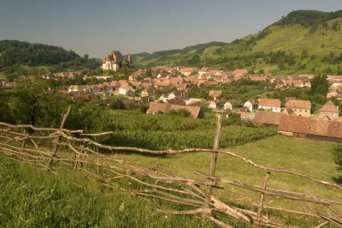 Framed Print : Romania, Sibiu, Biertan, townscape, fence in foreground Framed Print : Romania, Sibiu, Biertan, townscape, fence in foreground