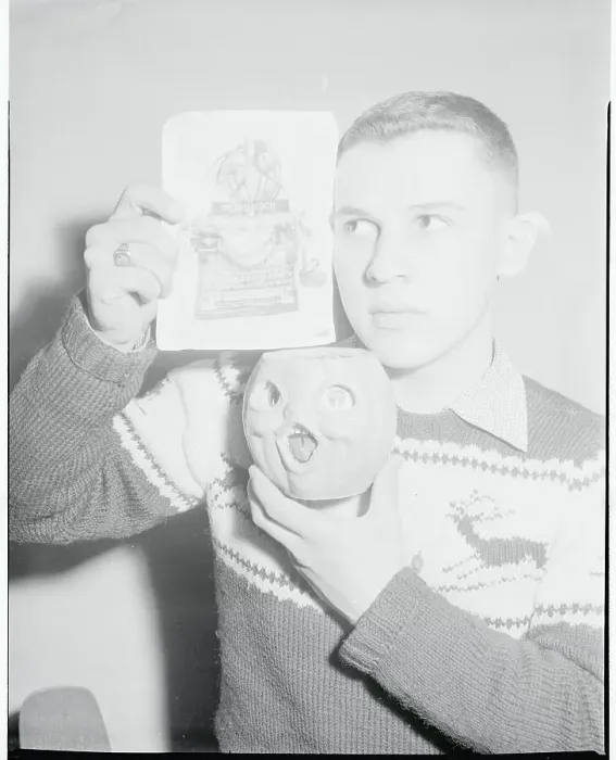 Framed Print : Ronald Mucha Holding a Pumpkin and Photograph Framed Print : Ronald Mucha Holding a Pumpkin and Photograph