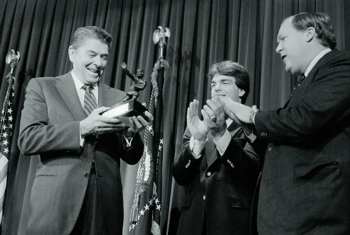 Framed Print : Ronald Reagan Holding Heisman Trophy Replica Framed Print : Ronald Reagan Holding Heisman Trophy Replica