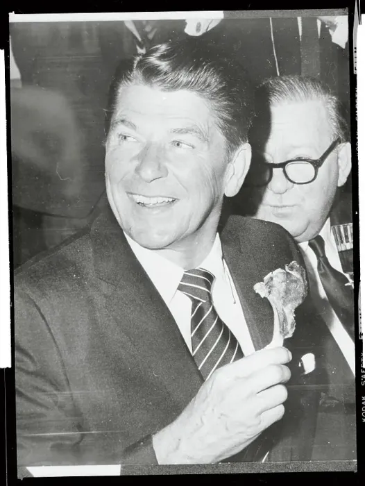 Framed Print : Ronald Reagan Holding a Lamb Chop Framed Print : Ronald Reagan Holding a Lamb Chop