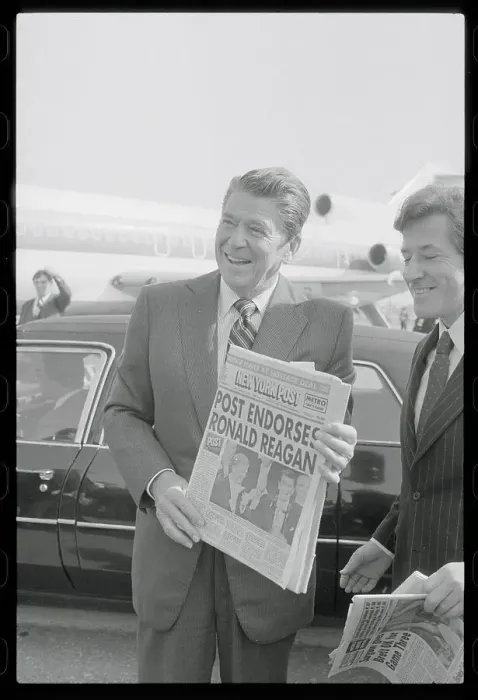 Framed Print : Ronald Reagan Holding Newspaper Framed Print : Ronald Reagan Holding Newspaper