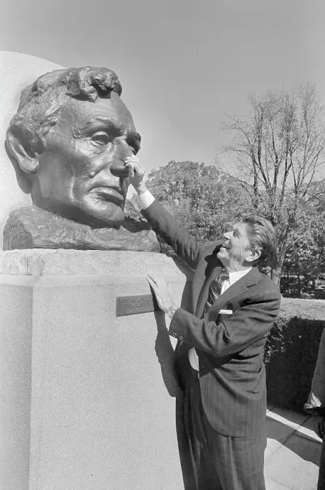 Framed Print : Ronald Reagan Rubbing the Nose of a Bust Framed Print : Ronald Reagan Rubbing the Nose of a Bust