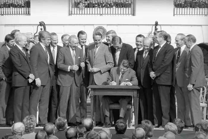 Framed Print : Ronald Reagan Signing Document with Onlookers Framed Print : Ronald Reagan Signing Document with Onlookers