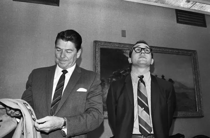 Framed Print : Ronald Reagan and Son Mike Standing in Office Framed Print : Ronald Reagan and Son Mike Standing in Office