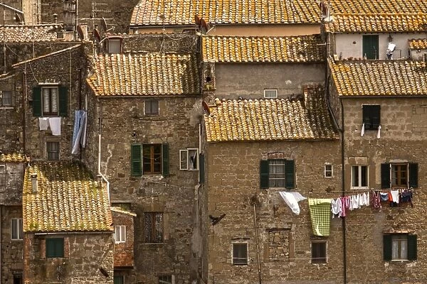 Roof Tops. Washing drying out side windows in the tuscany town of Sorano