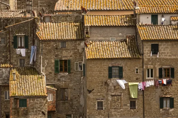 Framed Print : Roof Tops. Washing drying out side windows in the tuscany town of Sorano Framed Print : Roof Tops. Washing drying out side windows in the tuscany town of Sorano
