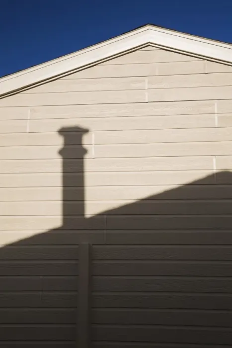Framed Print : Roofline and chimney shadow on the exterior side wall of a residential home, Quebec, Canada Framed Print : Roofline and chimney shadow on the exterior side wall of a residential home, Quebec, Canada