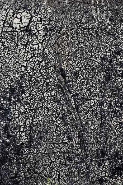 Framed Print : Rotted tar coating on a drum