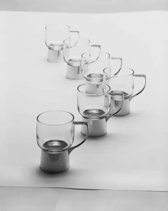 Framed Print : Row of juice extractors against white background