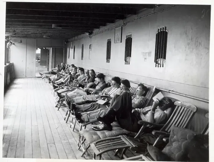 Framed Print : Row of Passengers on Ship Deck Chairs