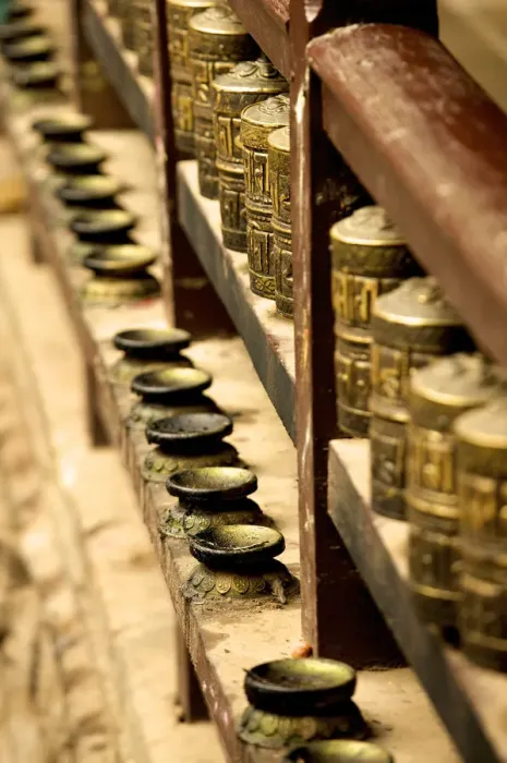 Framed Print : A row of prayer mills and butter lamps in the Golden Temple, a Buddhist temple, Patan, Nepal, Asia Framed Print : A row of prayer mills and butter lamps in the Golden Temple, a Buddhist temple, Patan, Nepal, Asia