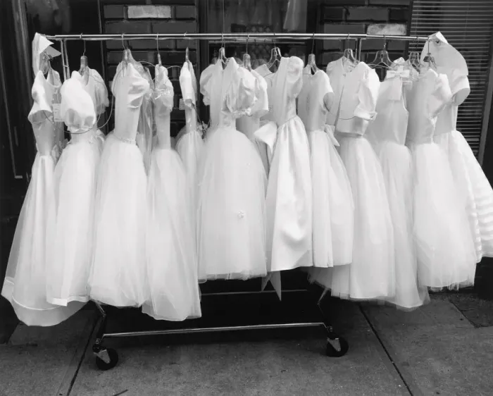 Framed Print : Row of white dresses hanging on rack Framed Print : Row of white dresses hanging on rack