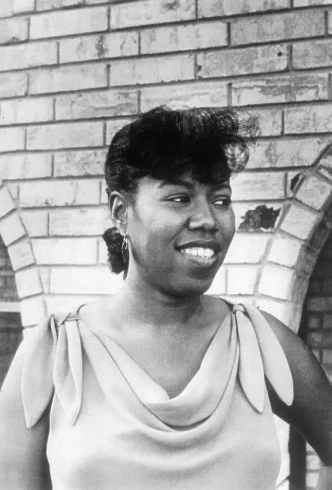 Framed Print : Ruby Bridges Smiling Outside Arched Building Framed Print : Ruby Bridges Smiling Outside Arched Building