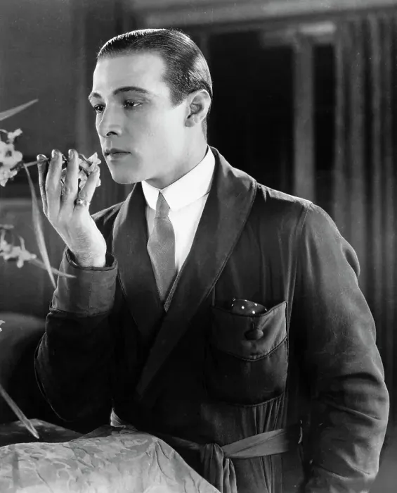 Framed Print : Rudolph Valentino Holding a Flower Framed Print : Rudolph Valentino Holding a Flower