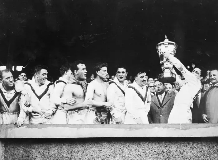 Framed Print : Rugby Players Holding Up Their Trophy Framed Print : Rugby Players Holding Up Their Trophy