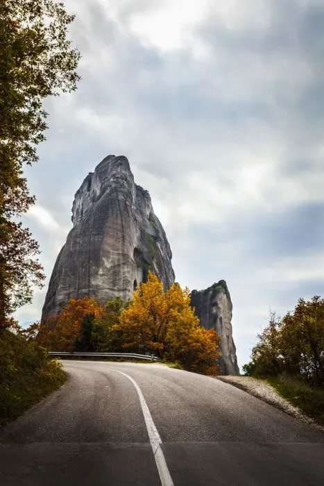 Framed Print : Rugged cliffs, road and autumn foliage Framed Print : Rugged cliffs, road and autumn foliage
